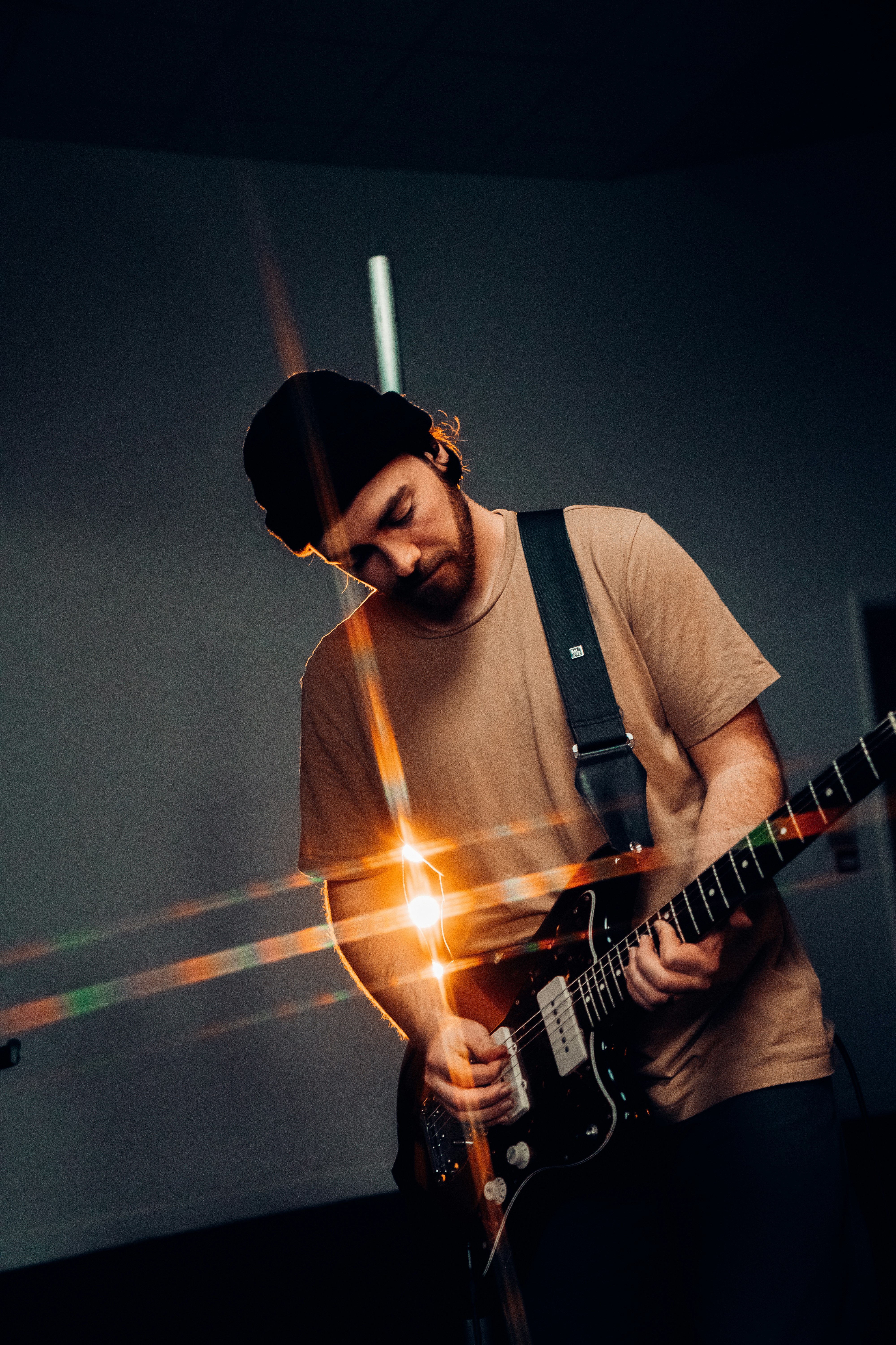 A man playing passionately the guitar
